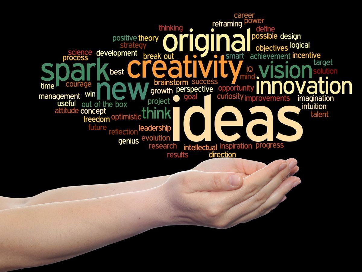 Concept conceptual creative new ideas or brainstorming abstract word cloud in hands isolated on background metaphor to spark, creativity, original, innovation, vision, think, achievement, smart genius
